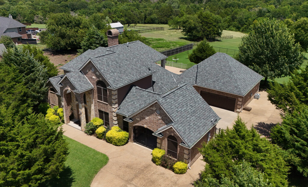 Centennial Roofing home in Midlothian, Texas with a new shingle roof after hail damage insurance claim, showing how roof replacement can lower premiums. - Centennial Contracting & Roofing